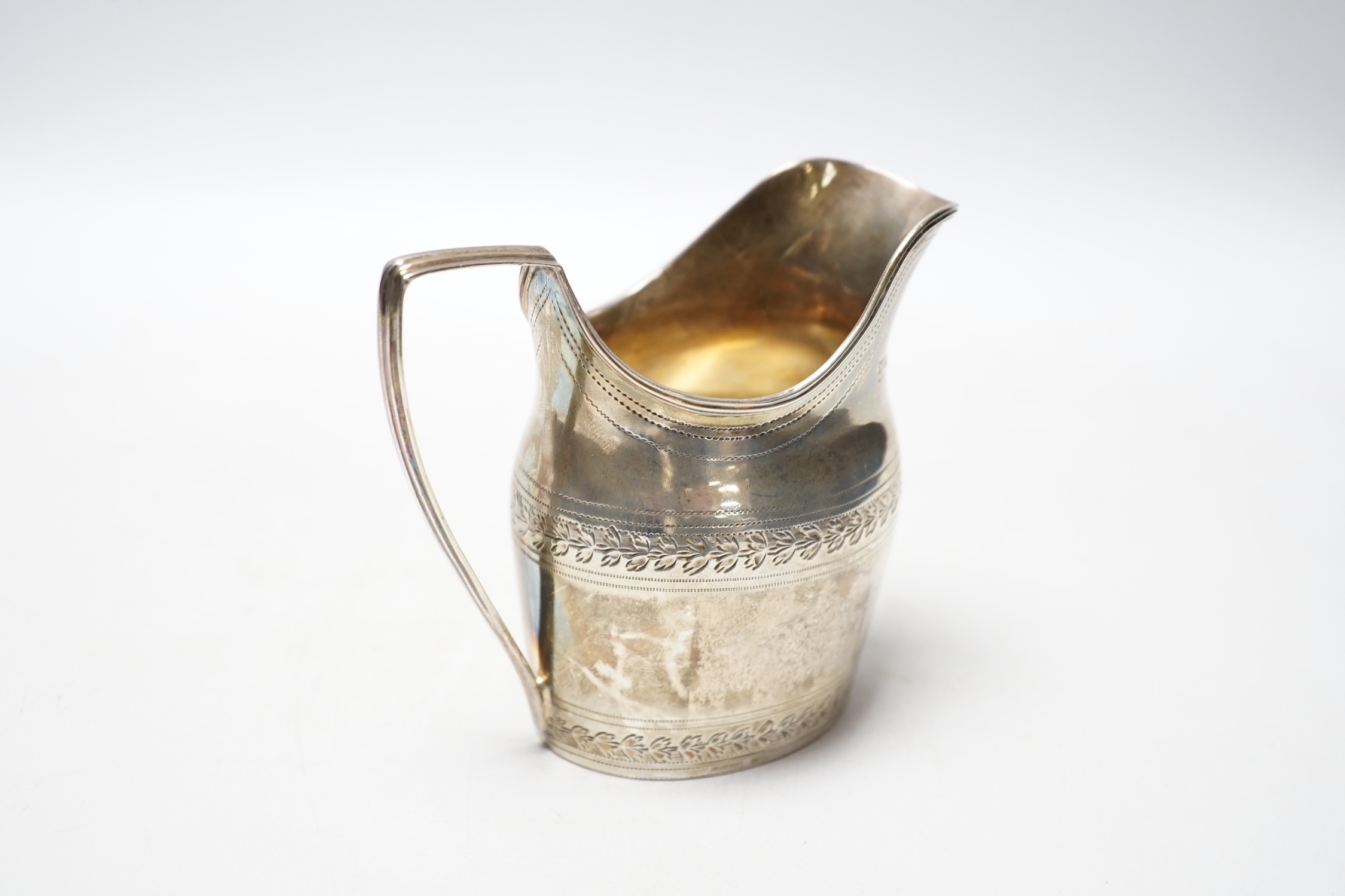 A George III silver engraved helmet shaped cream jug, Godbehere & Wigan, London, 1796, 10cm, 5.3oz.